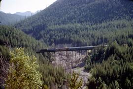 Great Northern Railway Train 28 east of Essex, Montana on trestle bridge in 1969.