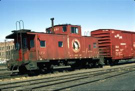 Great Northern Railway Caboose X-91 in red color scheme at Pasco Washington in 1971.