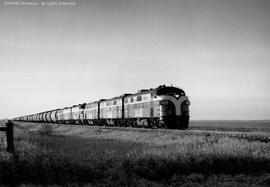 Six Great Northern F-units pull Great Northern Railway's first unit potash train of 118 cars, cir...