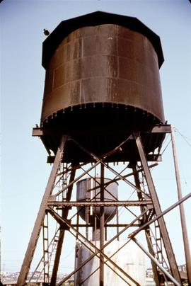 Great Northern Railway oil tank at Seattle, Washington, water tower in background