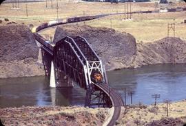 Great Northern Railway Bridge over Columbia River at Wenatchee, Washington and freight train.