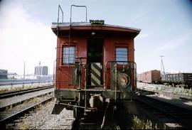 Great Northern Railway Caboose X-202 in red color scheme; end view only at Seattle, Washington.