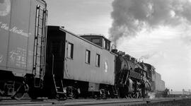 Great Northern Caboose X664 and Steam Locomotive 3042 at HIllyard, Washington, undated