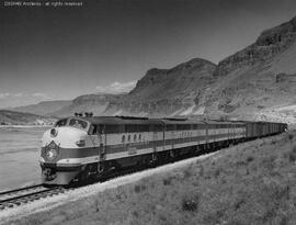 Great Northern diesel locomotive 428 leads an eastbound freight train near the Columbia River sid...