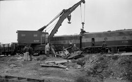 Great Northern Crane X1737 and Diesel Locomotive 472B at Quincy, Washington, undated