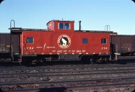 Great Northern Railway Caboose X-94 in red color scheme at Whitefish Montana in 1971.
