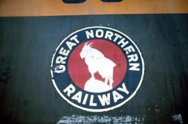 Closeup of Great Northern Railway locomotive herald; appears to be on side below cab window