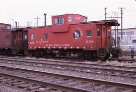 Great Northern Railway Caboose X-102 in red color scheme.