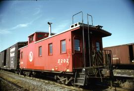 Great Northern Railway Caboose X-202 in red color scheme at Seattle, Washington.