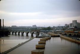 Great Northern Railway Train Number 32, Empire Builder, leaving Minneapolis on stone arch bridge ...