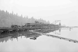 Log Train at Weyerhaeuser Company Pier at South Bay, Washington in April 1976.