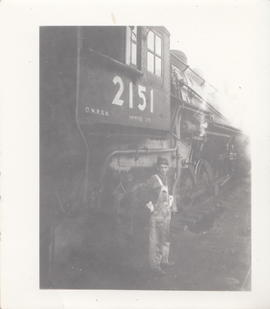 Engineer William Woody alongside Oregon-Washington Railroad and Navigation steam locomotive 2151 ...