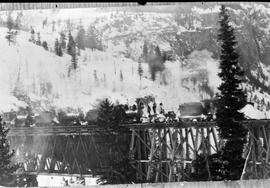 Four locomotives on a trestle bridge in Colorado, circa 1925.