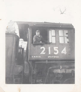 Engineer William Woody on Oregon-Washington Railroad and Navigation steam locomotive 2154 circa 1...