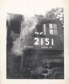 Engineer William Woody on Oregon-Washington Railroad and Navigation steam locomotive 2151 circa 1...