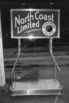 Gate sign for North Coast Limited at King Street Station, Seattle, Washington, in 1955.