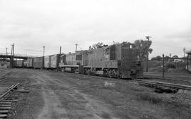 Chicago, Rock Island & Pacific Railroad diesel locomotives 1224 and 211 lead a train at Missi...