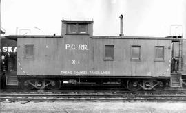 Pacific Coast Railroad caboose number X1 at unknown, Washington, circa 1956.