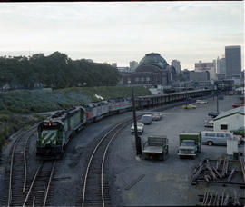 Burlington Northern diesel locomotive 2520 assist Amtrak power at Tacoma, Washington, in 1979.