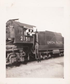 Fireman William Woody on Oregon-Washington Railroad and Navigation steam locomotive 2151 circa 19...