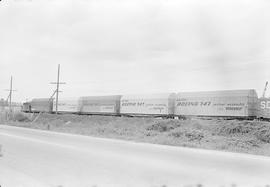 Burlington Northern freight train led by diesel locomotive 6007D at Renton, Washington in 1970.