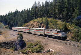 Amtrak diesel locomotive 395 leads train number 25 at Motanic, Oregon on August 6, 1986.