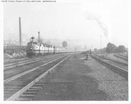 Great Northern Diesel Locomotive 503 Leading a Passenger Train at Interbay, Washington in 1947.