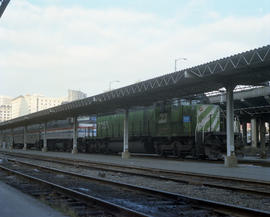 Burlington Northern diesel locomotive 7055 assists train number 7 at Seattle, Washington, on Dece...