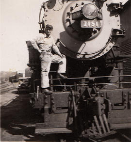 Engineer William Woody on Oregon-Washington Railroad and Navigation steam locomotive 2151 circa 1...