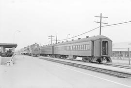 Southern Pacific Railroad Commuter train No. 112 passes another commuter train at the at the Redw...