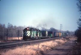 Burlington Northern Diesel Locomotives Number 1403, and Two Unidentified GP's In 1981