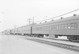 A Southern Pacific Railroad Fairbanks-Morse unit with a commuter train leaves Redwood City, Calif...