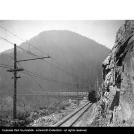 Milwaukee Road electric locomotive on the Change Creek bridge near Garcia, Washington in 1927.