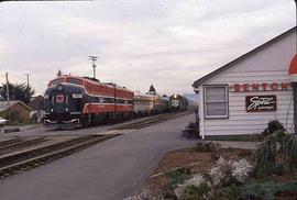 Spirit of Washington Dinner Train and Burlington Northern freight train at Renton, Washington, ci...