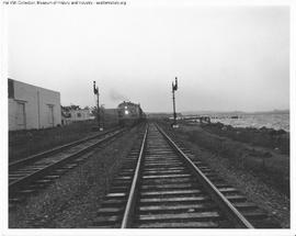 Great Northern Diesel Locomotive 511 leading a Passenger Train at Interbay, Washington in 1947.